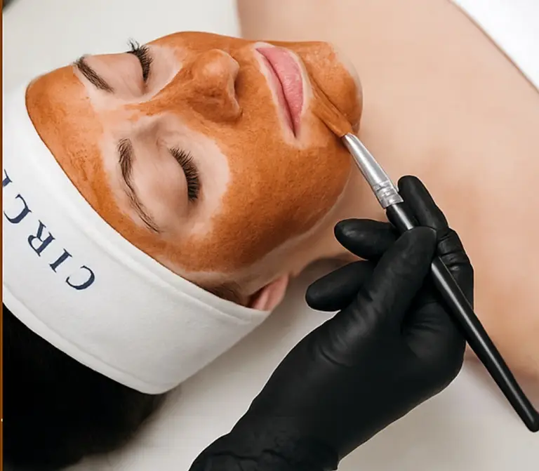 Enzyme mask being applied during a custom facial